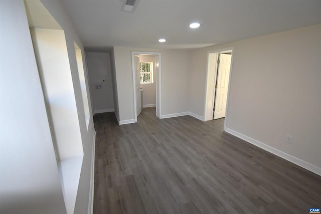 unfurnished room featuring dark hardwood / wood-style flooring