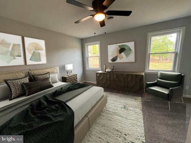 carpeted bedroom featuring ceiling fan