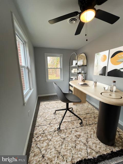 office area featuring carpet flooring and ceiling fan