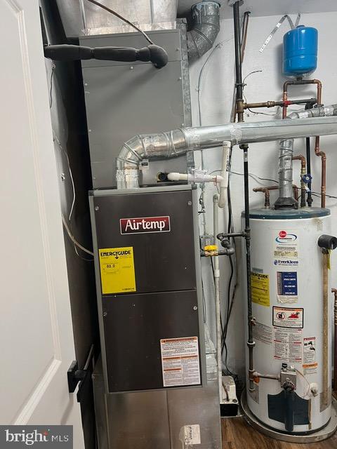 utility room with water heater