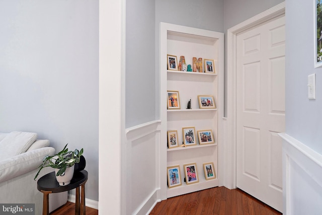 hall with dark hardwood / wood-style floors