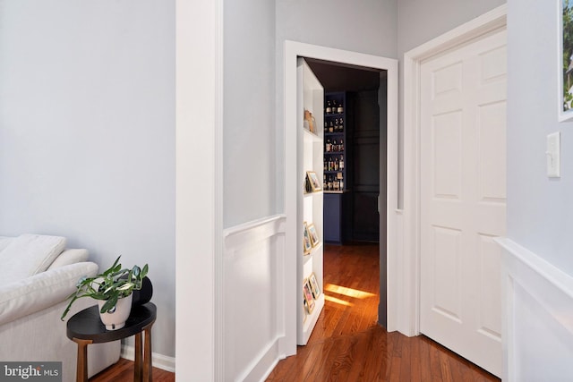 corridor featuring hardwood / wood-style floors