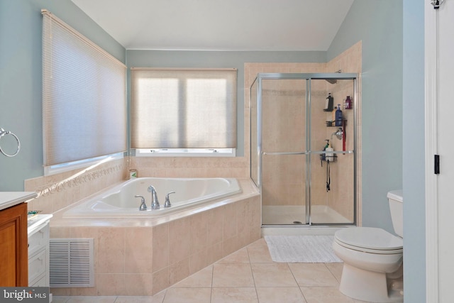 full bathroom featuring tile patterned flooring, lofted ceiling, toilet, vanity, and independent shower and bath