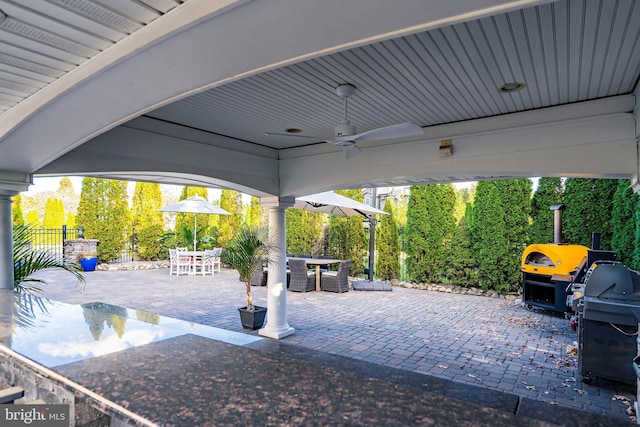 view of patio / terrace with ceiling fan and area for grilling