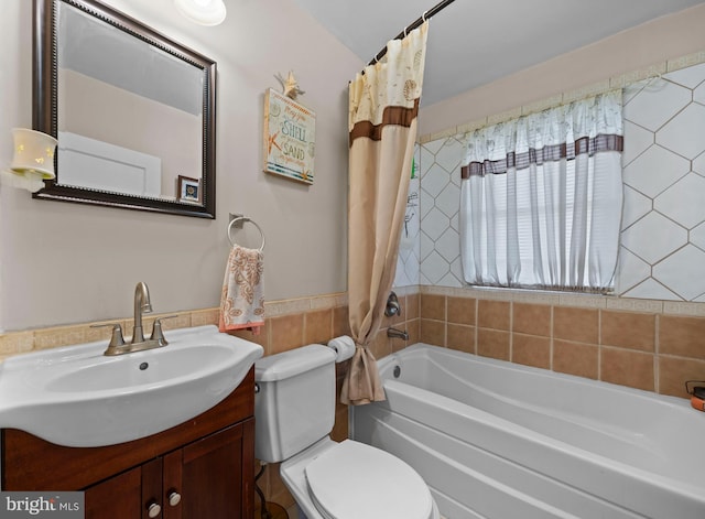 full bathroom with vanity, shower / bath combination with curtain, and toilet