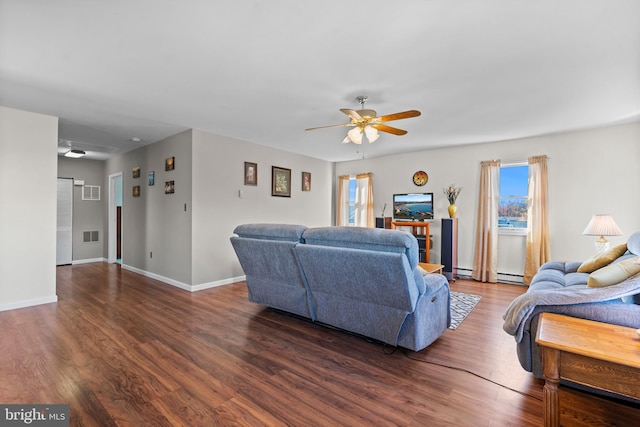 living room featuring ceiling fan and dark wood-type flooring