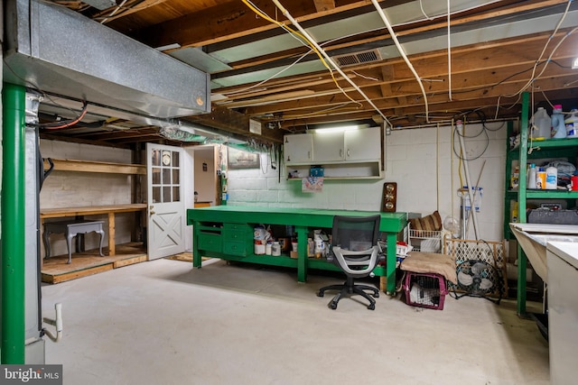 basement with a workshop area