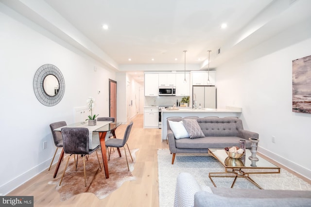 living room with light hardwood / wood-style floors