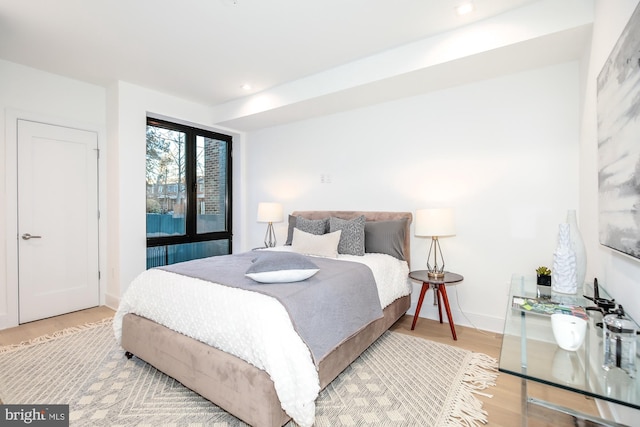 bedroom with light hardwood / wood-style floors