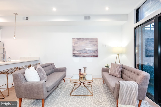 living room with light hardwood / wood-style floors