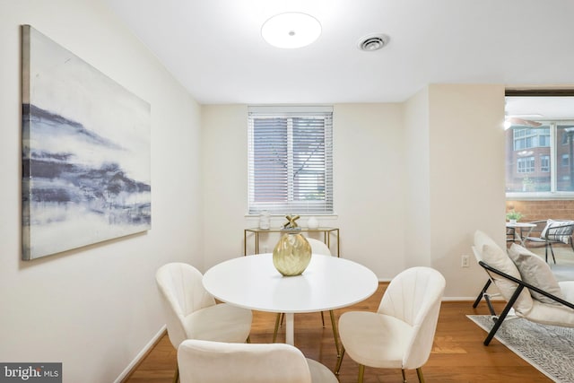 dining room with hardwood / wood-style floors