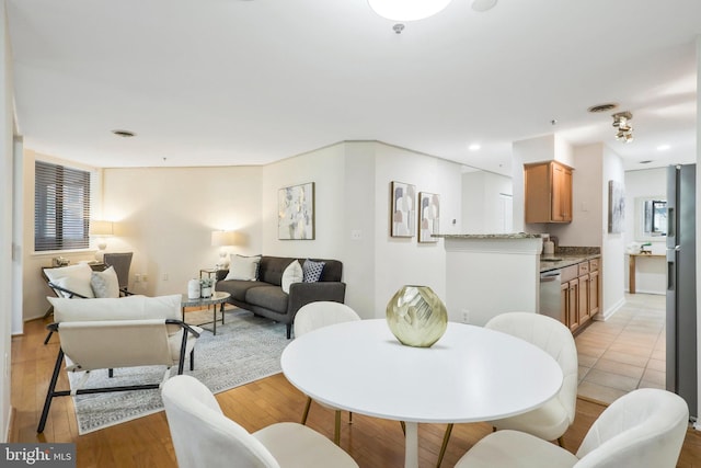 dining room featuring light hardwood / wood-style floors