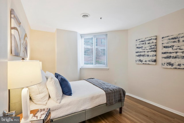 bedroom featuring hardwood / wood-style flooring