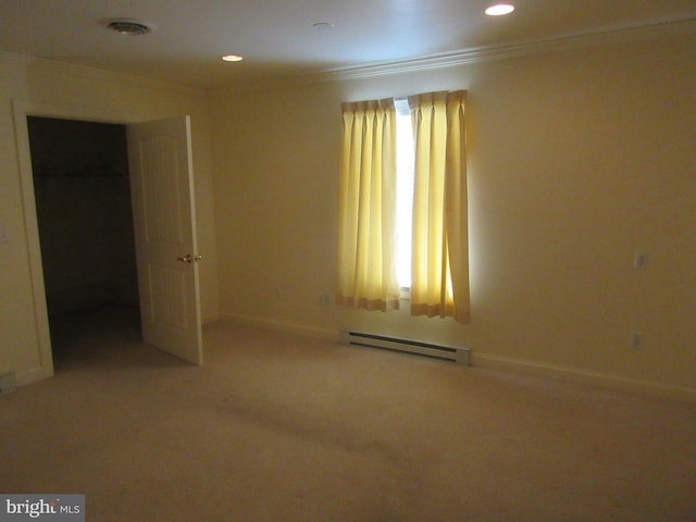 carpeted spare room with a baseboard radiator