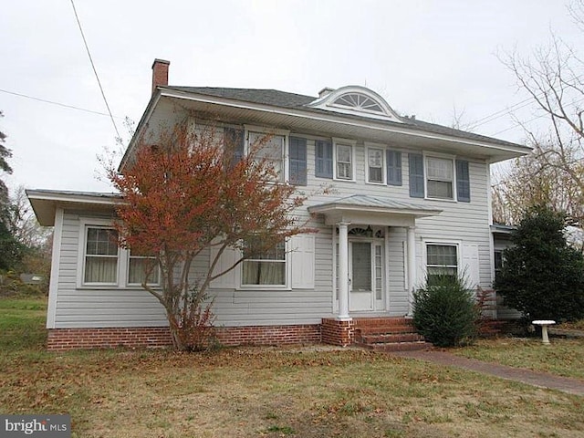 view of front of home featuring a front lawn