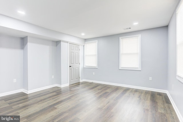 basement featuring dark wood-type flooring