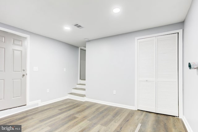 basement featuring hardwood / wood-style floors