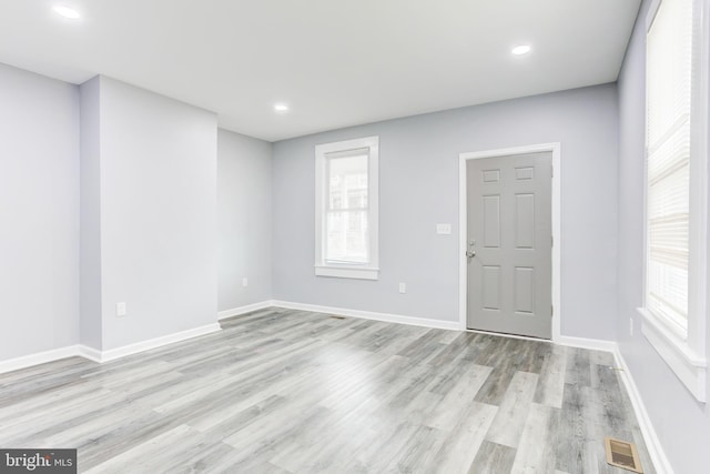 spare room with light wood-type flooring