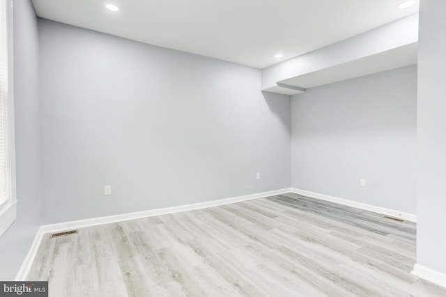 basement featuring light hardwood / wood-style flooring