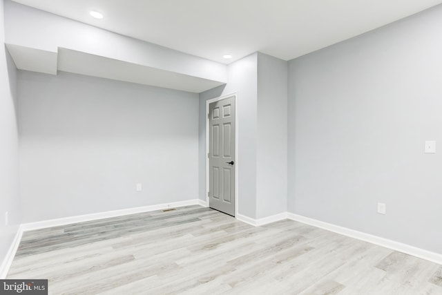 unfurnished room with light hardwood / wood-style flooring