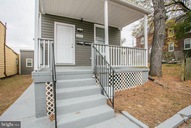 doorway to property featuring a porch