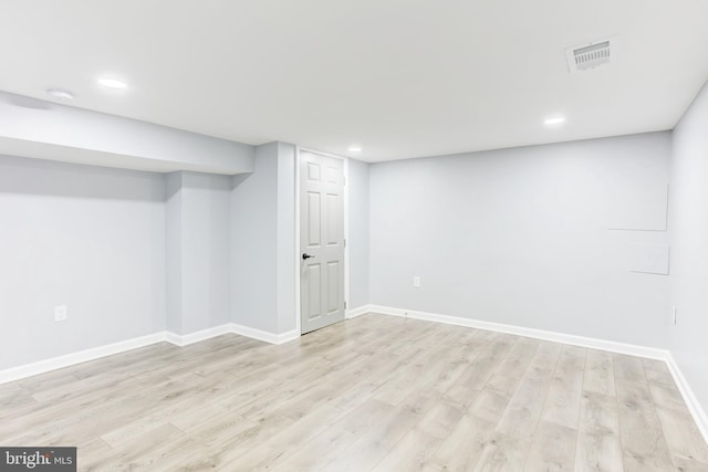 basement featuring light hardwood / wood-style floors