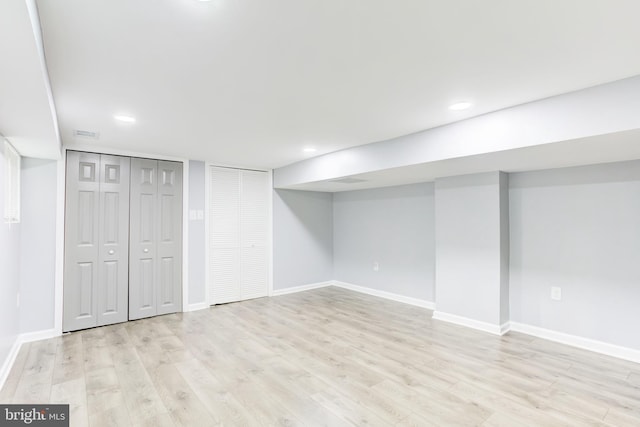 basement featuring light hardwood / wood-style floors