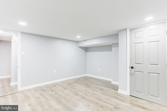 basement featuring light wood-type flooring