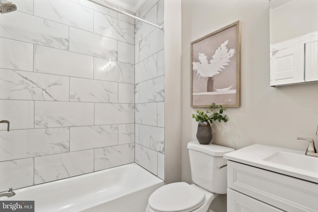 full bathroom featuring vanity, toilet, and tiled shower / bath