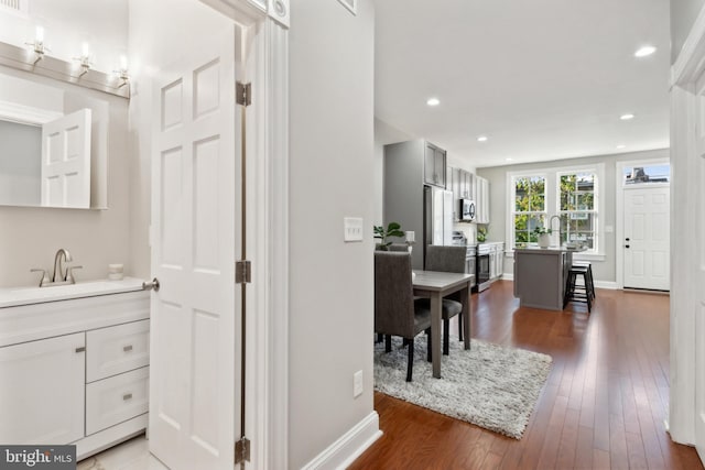 bathroom with vanity and hardwood / wood-style flooring