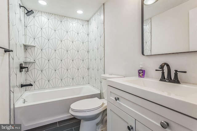 full bathroom with vanity, toilet, and tiled shower / bath combo