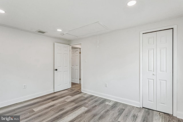 spare room featuring light hardwood / wood-style floors