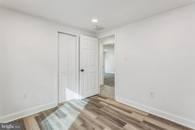 unfurnished bedroom featuring light wood-type flooring