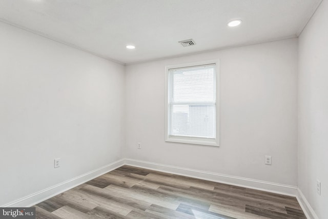 spare room with hardwood / wood-style flooring