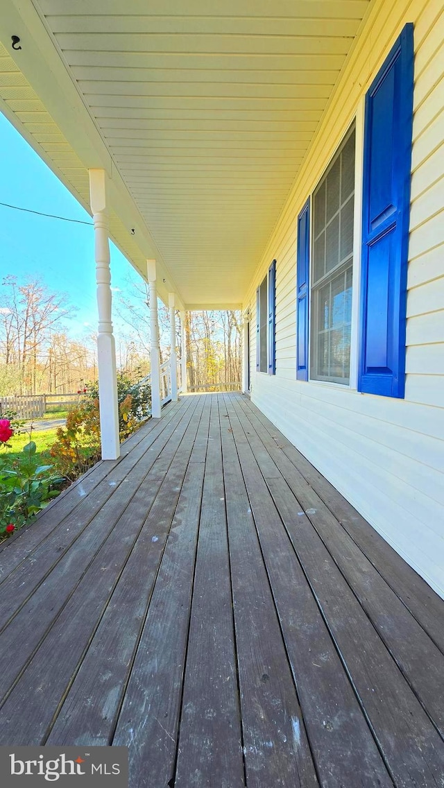 wooden terrace with a porch