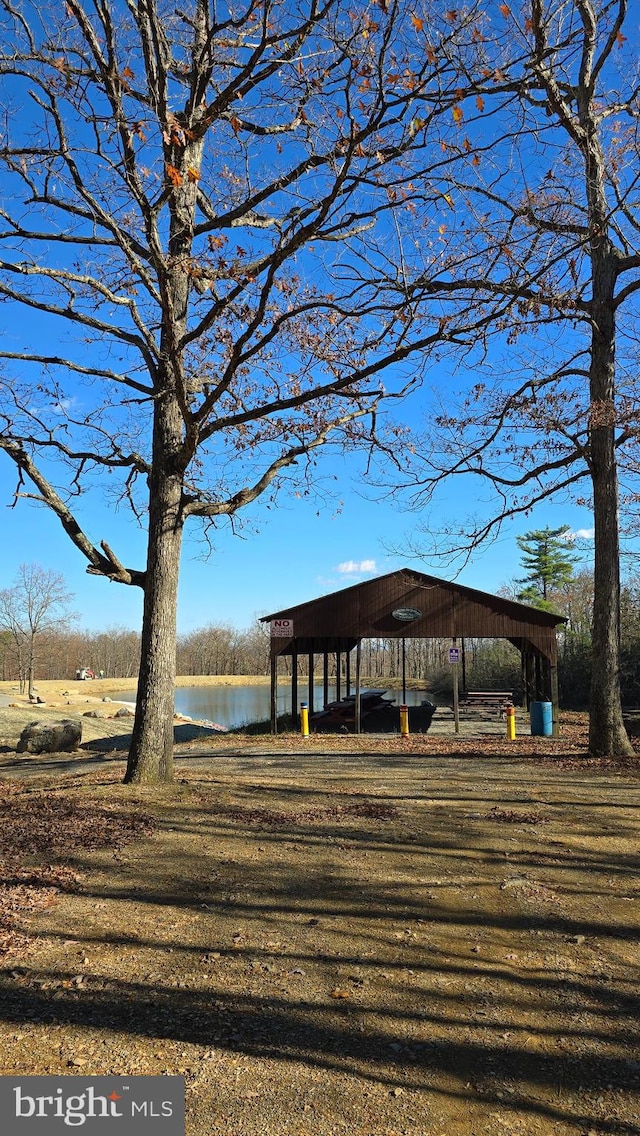 surrounding community with a water view