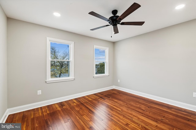 unfurnished room featuring ceiling fan and hardwood / wood-style flooring