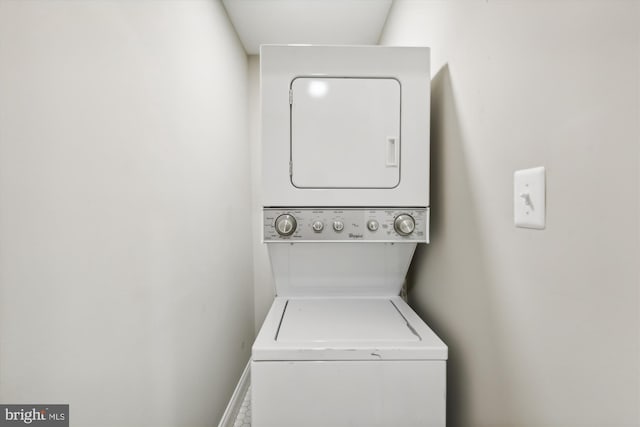 laundry area with stacked washer / drying machine