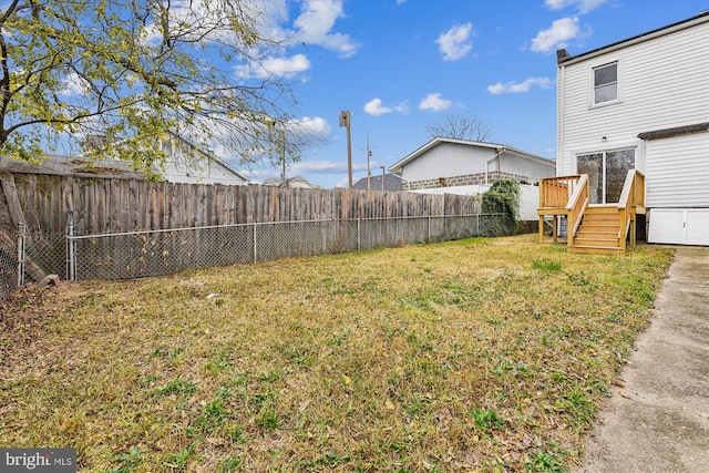 view of yard with a wooden deck