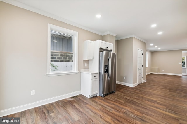 kitchen with dark hardwood / wood-style floors, crown molding, white cabinetry, and stainless steel refrigerator with ice dispenser