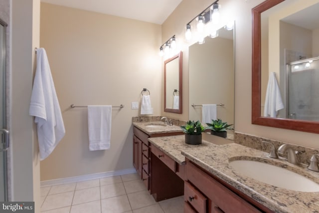 bathroom featuring vanity, tile patterned floors, and an enclosed shower