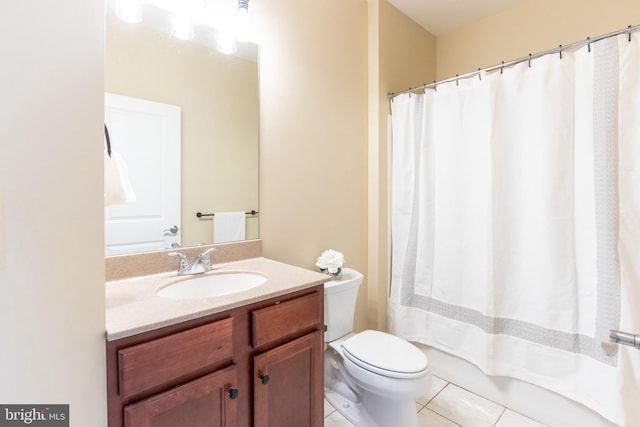 bathroom with tile patterned floors, vanity, and toilet