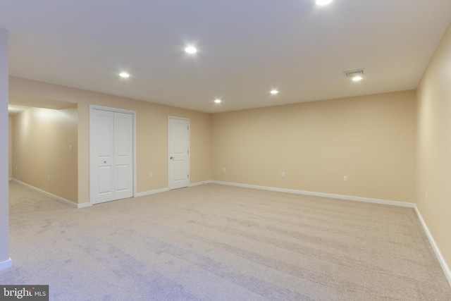 basement with light colored carpet