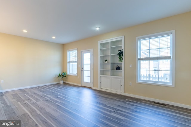 empty room with wood-type flooring