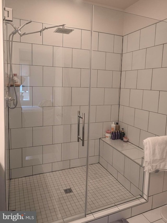 bathroom with a shower with shower door