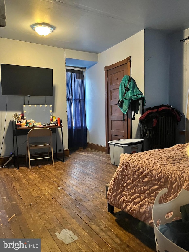 bedroom with hardwood / wood-style floors