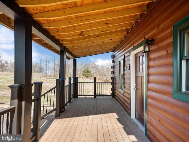 wooden terrace featuring a porch