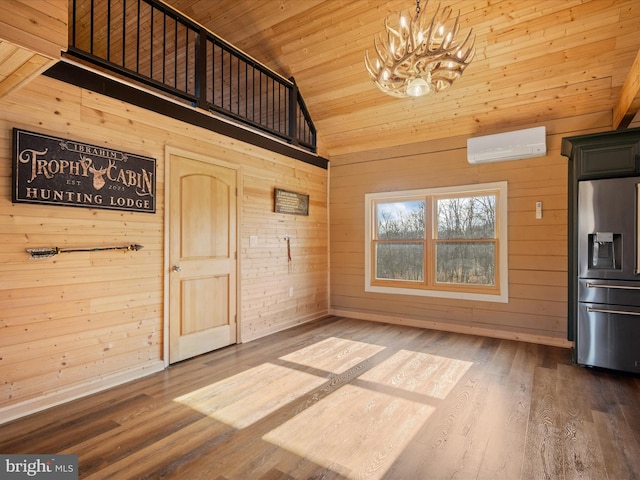 unfurnished dining area with a wall mounted air conditioner, wooden walls, wood-type flooring, high vaulted ceiling, and wooden ceiling