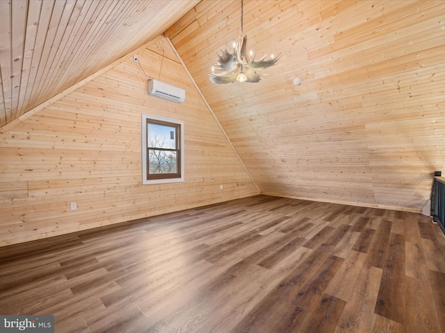 additional living space with hardwood / wood-style floors, wooden ceiling, an AC wall unit, wooden walls, and vaulted ceiling