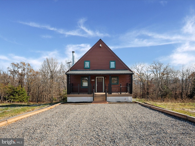 log-style house with a porch